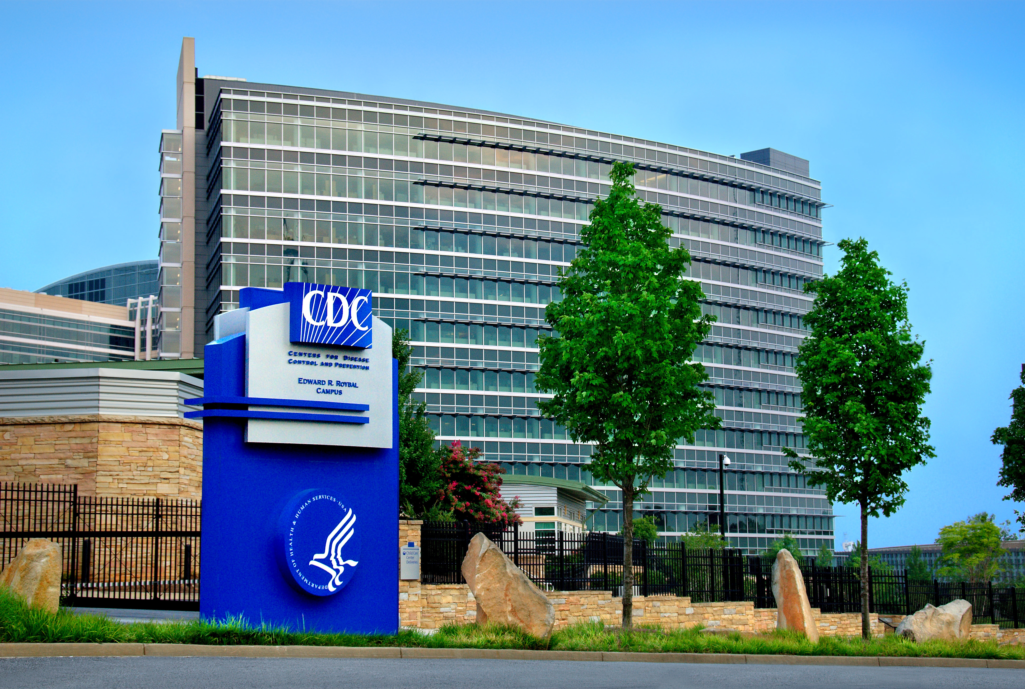 A large building is shown with a sign for the CDC shown in the foreground. This is the CDC headquarters in Atlanta, GA.